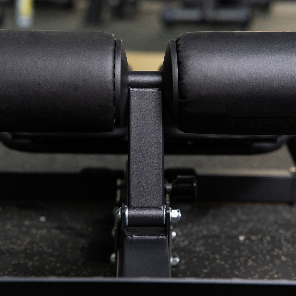 Black adjustable TFP Fitness adjustable back extension machine on a plain white background.