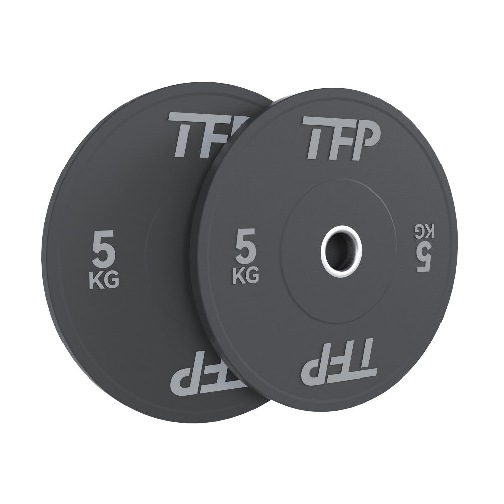 Two black 5kg olympic bumper plates with white TFP branding, shown overlapping on a plain white background.