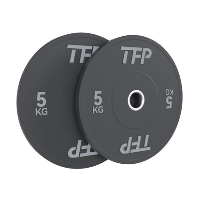 Two black 5kg olympic bumper plates with white TFP branding, shown overlapping on a plain white background.