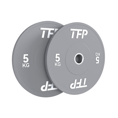 Two grey 5 kg Olympic bumper plates with white TFP branding, shown overlapping on a plain white background.