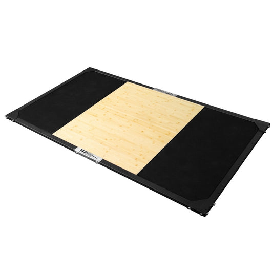 A rectangular TFP Fitness weightlifting platform featuring a natural bamboo center panel flanked by black rubber mats, shown on a plain white background.