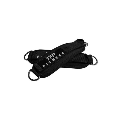 Black TFP Fitness ankle cable attachment with a silver metal D-ring, shown on a plain white background.
