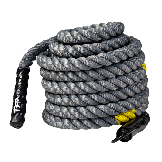 A coiled competition sled rope with black handles and yellow accents, photographed on a clean white background.