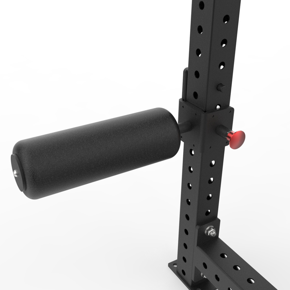 A black leg roller from TFP Fitness with a mounting bracket and a red release button, shown against a plain white background.