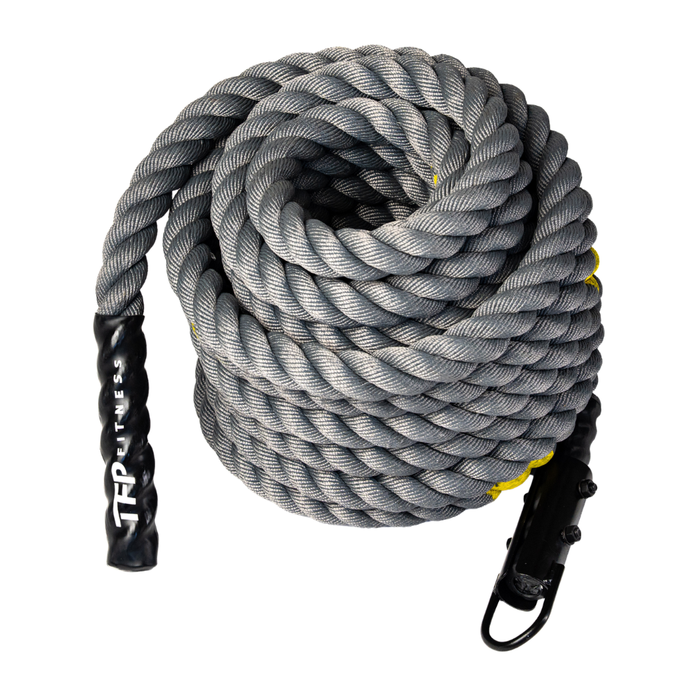 A coiled competition sled rope with black handles and clips, featuring the brand name 'TP FITNESS' printed on one handle, set against a plain white background.