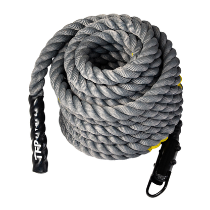A coiled competition sled rope with black handles and clips, featuring the brand name 'TP FITNESS' printed on one handle, set against a plain white background.