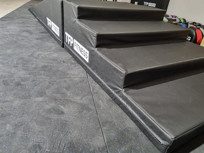 A set of Hand Stand Walk Ramp with Stairs - Pro Series in a fitness gym.